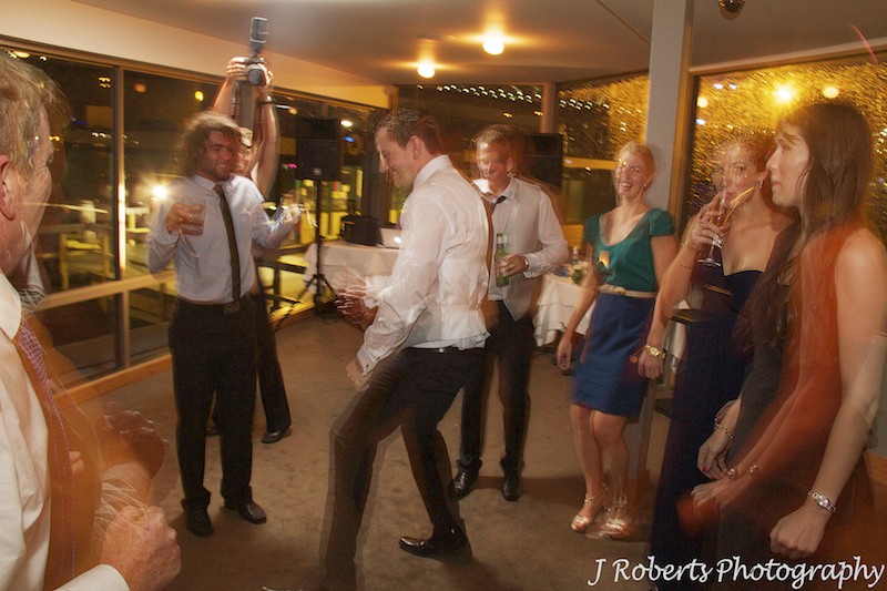 Boogying on the dance floor at wedding reception - wedding photography sydney